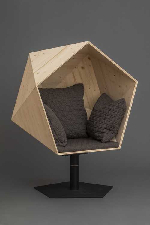 Corner-Retreat - Wurth Machinery Soft chair enclosed in a geometric shell on pedestal