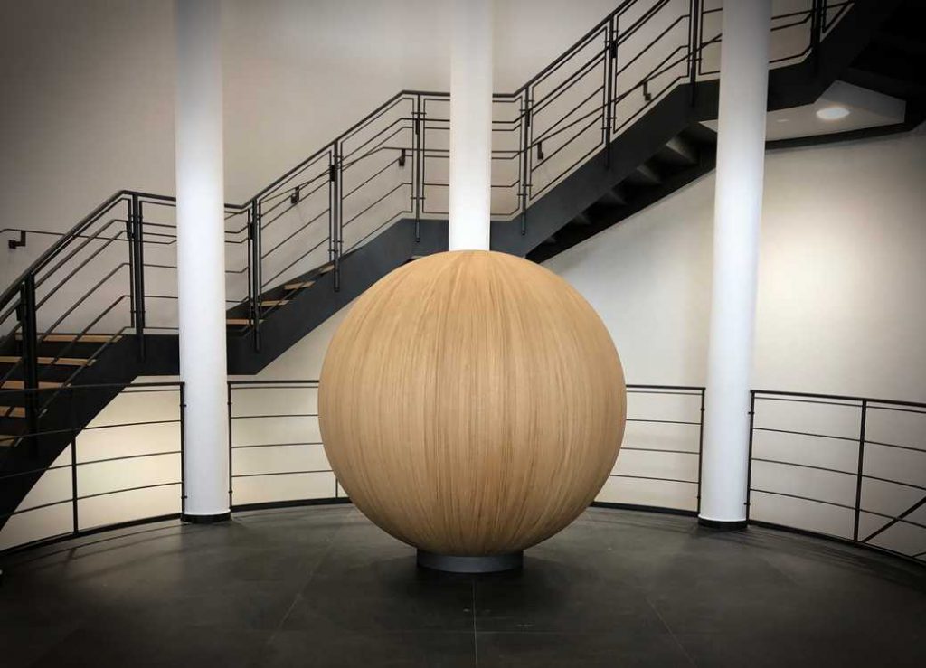 ball - Wurth Machinery Wood ball art in middle of room